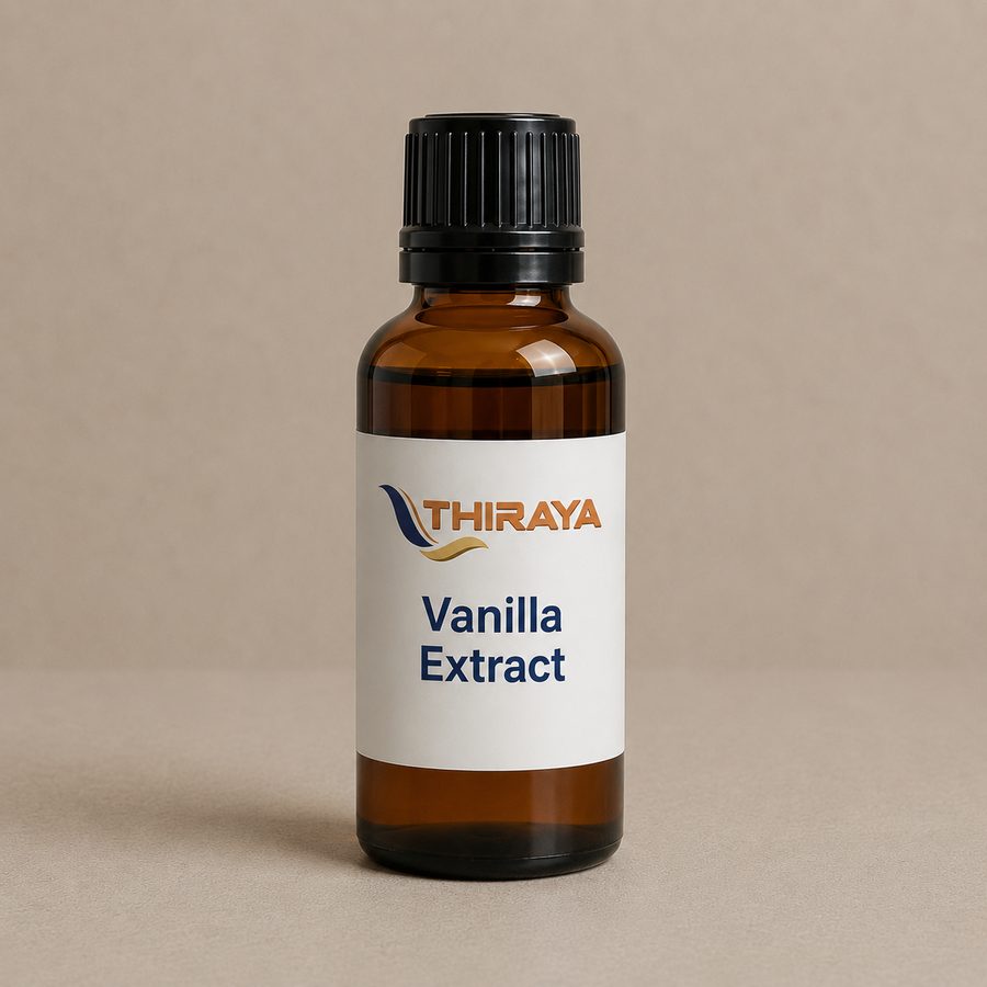 Vanilla extract in a bottle beside cured beans