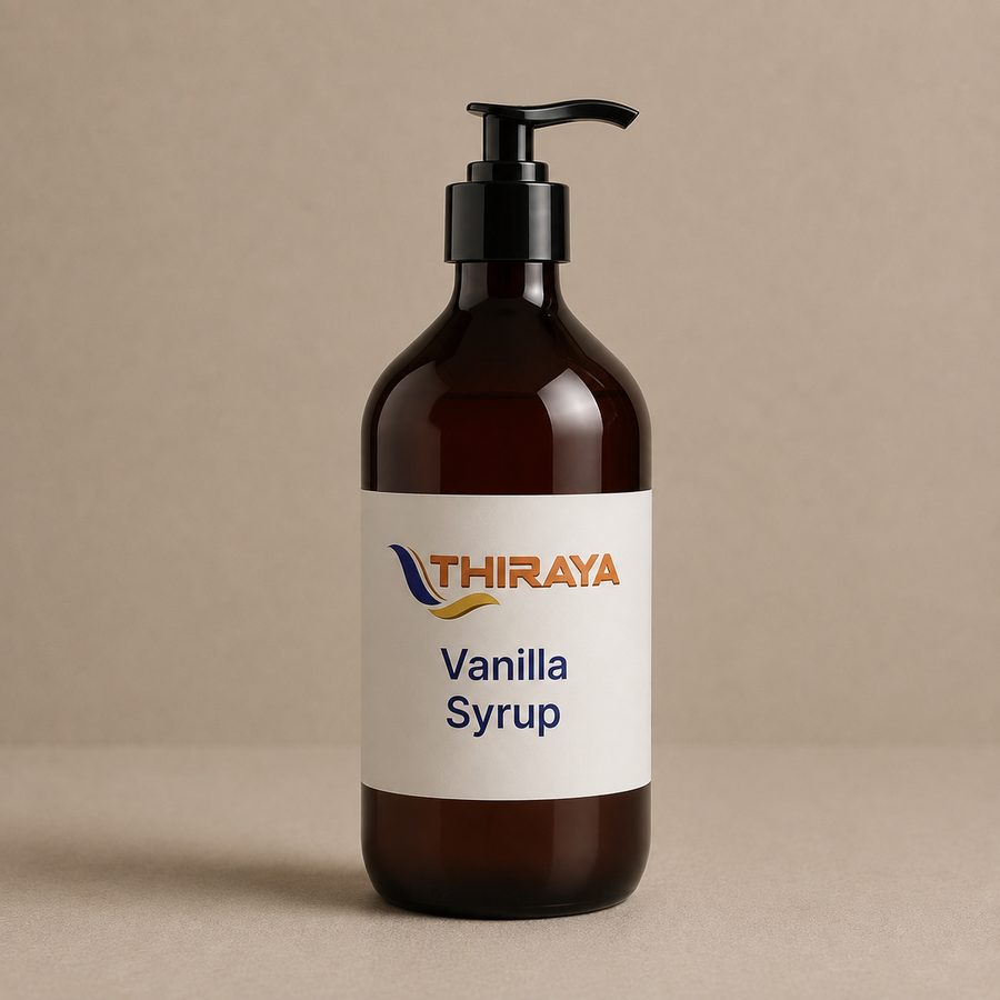 Vanilla syrup being poured, catching the light